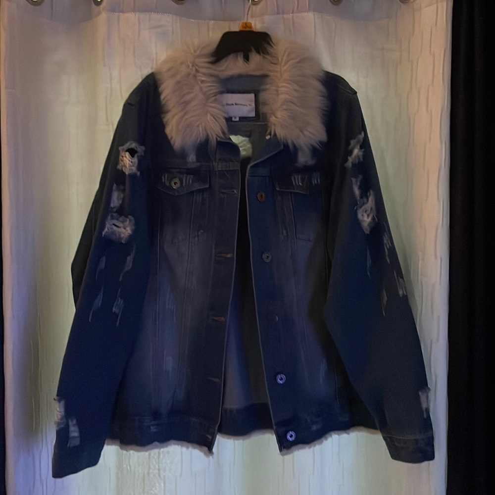 Blue Jean jacket with holes. Wore one time only.